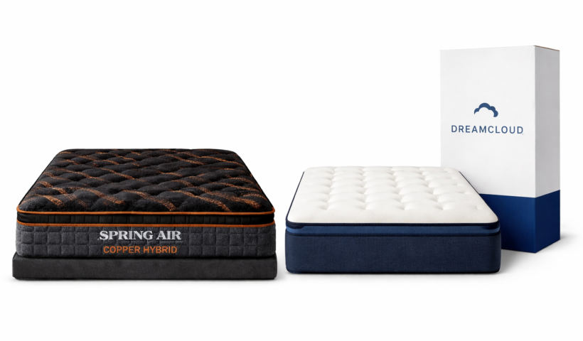 Spring Air Copper Hybrid mattress with black copper-infused top beside DreamCloud bed-in-a-box mattress and shipping box